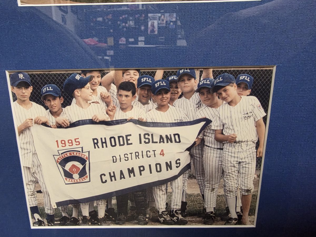The 1995 Scituate Foster Little League All Stars holding a Rhode Island District 4 Champions banner